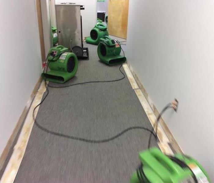 SERVPRO equipment in a commercial hallway 