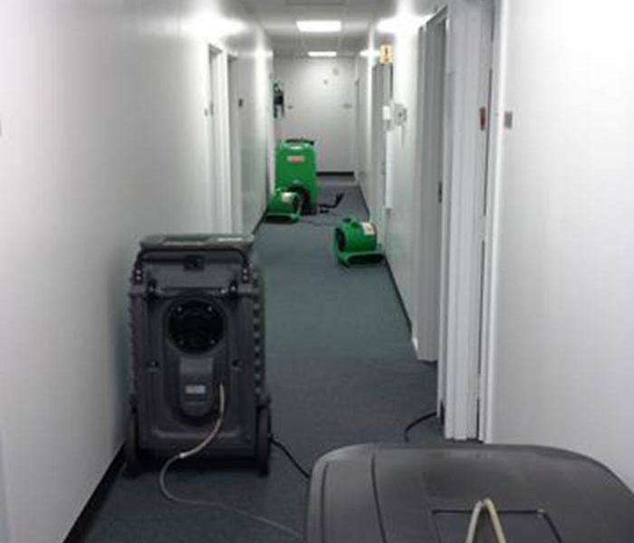 SERVPRO equipment in a commercial hallway 