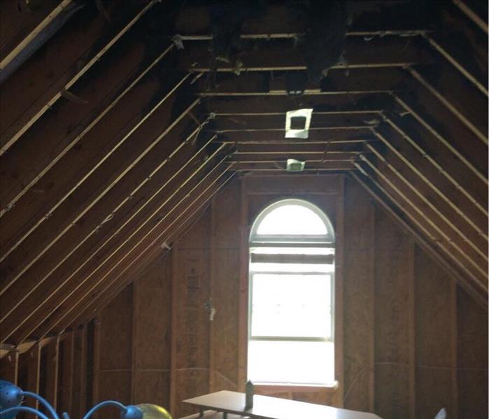 Wood structure of a upstairs room with a window