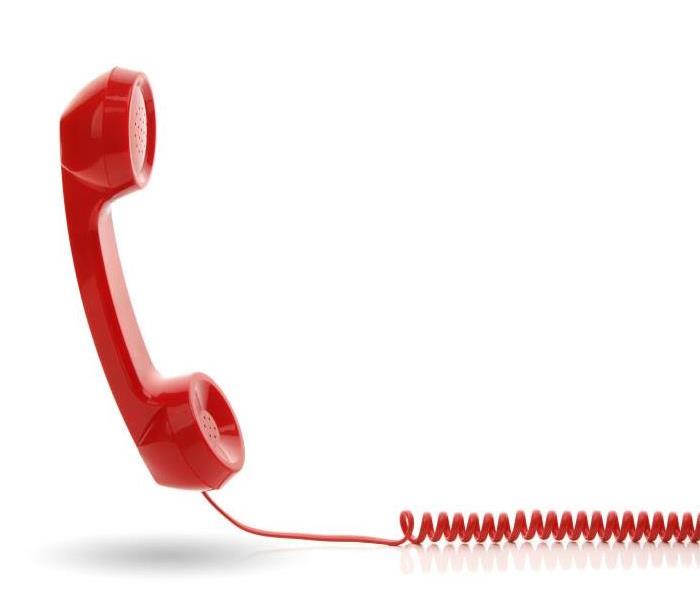 red telephone with spiral cord