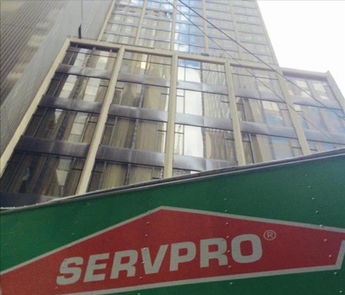 looking up at a tall building and SERVPRO 18 wheeler
