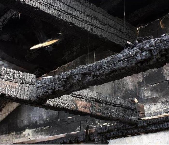 charred trusses in an attic