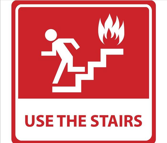 metal sign use the stairs during a fire